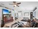 Open living room with a large TV, comfy seating, and dining area view at 3457 Raleigh Dr, Winter Haven, FL 33884