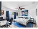 Spacious main bedroom with large bed, ceiling fan, and access to a balcony at 3457 Raleigh Dr, Winter Haven, FL 33884