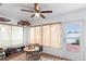 Relaxing sunroom with wicker furniture, ceiling fan, and access to patio at 3457 Raleigh Dr, Winter Haven, FL 33884