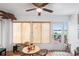 Bright sunroom with patio access, ceiling fan, and wicker furniture at 3457 Raleigh Dr, Winter Haven, FL 33884