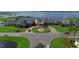 Aerial view of community clubhouse near lake at 3834 Litchfield Loop, Lake Wales, FL 33859