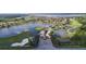 Aerial view of luxury community with lake, golf course, and upscale homes at 3834 Litchfield Loop, Lake Wales, FL 33859