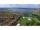 Aerial view of community with lake, golf course and homes at 3834 Litchfield Loop, Lake Wales, FL 33859