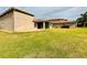 Spacious backyard featuring a patio and lush green grass at 3834 Litchfield Loop, Lake Wales, FL 33859