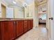 Spacious bathroom with double vanity and view of bedroom at 3834 Litchfield Loop, Lake Wales, FL 33859