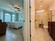Bedroom with ensuite bathroom and window coverings at 3834 Litchfield Loop, Lake Wales, FL 33859