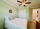 Bedroom with ceiling fan and ample closet space at 3834 Litchfield Loop, Lake Wales, FL 33859