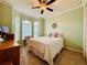 Spacious bedroom with ceiling fan and large windows at 3834 Litchfield Loop, Lake Wales, FL 33859