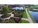 Resort-style pool with lush landscaping and community clubhouse at 3834 Litchfield Loop, Lake Wales, FL 33859