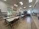 Community room with tables and chairs for crafting or meetings at 3834 Litchfield Loop, Lake Wales, FL 33859