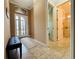 Bright and spacious entryway with tile flooring and bench at 3834 Litchfield Loop, Lake Wales, FL 33859