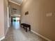 Bright and spacious entryway with tile floors and bench at 3834 Litchfield Loop, Lake Wales, FL 33859