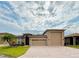 Beautiful home with a two-car garage and well-manicured lawn at 3834 Litchfield Loop, Lake Wales, FL 33859