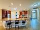 Large kitchen island with granite countertops and seating at 3834 Litchfield Loop, Lake Wales, FL 33859