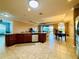 Island kitchen features granite countertops and stainless steel appliances at 3834 Litchfield Loop, Lake Wales, FL 33859