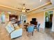 Open concept living room with kitchen views and neutral color palette at 3834 Litchfield Loop, Lake Wales, FL 33859