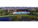 Community pool with surrounding landscaping and patio furniture at 3834 Litchfield Loop, Lake Wales, FL 33859