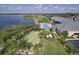 Resort-style pool with bocce ball courts and lush landscaping at 3834 Litchfield Loop, Lake Wales, FL 33859