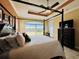 Bright Primary bedroom with a four-poster bed and water views at 3834 Litchfield Loop, Lake Wales, FL 33859