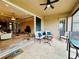 Relaxing screened patio with seating and view to the interior at 3834 Litchfield Loop, Lake Wales, FL 33859