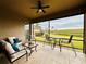 Covered patio overlooking a tranquil pond view at 3834 Litchfield Loop, Lake Wales, FL 33859