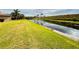 Peaceful waterfront view with lush landscaping and canal at 3834 Litchfield Loop, Lake Wales, FL 33859