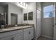 Double vanity bathroom with modern fixtures and linen closet at 3946 Bedford Ave, Winter Haven, FL 33884
