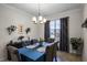 Formal dining room with a chandelier and seating for six at 3946 Bedford Ave, Winter Haven, FL 33884
