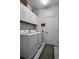 Laundry room with washer, dryer, and overhead cabinets at 3946 Bedford Ave, Winter Haven, FL 33884