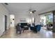Open living space with comfy seating, large windows and access to patio at 3946 Bedford Ave, Winter Haven, FL 33884