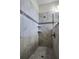 Modern shower with tiled walls and built-in shelves at 3946 Bedford Ave, Winter Haven, FL 33884