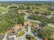 Aerial view of houses and a neighborhood with lush greenery at 3966 Oak Loop # 13, Mulberry, FL 33860
