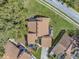 Aerial view of a house with a brown roof and driveway at 3966 Oak Loop # 13, Mulberry, FL 33860