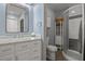 Updated bathroom with white vanity and walk-in shower at 3966 Oak Loop # 13, Mulberry, FL 33860