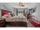 Main bedroom with sliding door to backyard and ceiling fan at 3966 Oak Loop # 13, Mulberry, FL 33860
