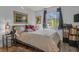 Guest bedroom with striped bedding and window seat at 3966 Oak Loop # 13, Mulberry, FL 33860