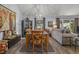 Bright dining room with a six-chair table and adjacent living room at 3966 Oak Loop # 13, Mulberry, FL 33860