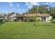 Single story house with a covered patio and large backyard at 3966 Oak Loop # 13, Mulberry, FL 33860