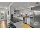 Modern kitchen with stainless steel appliances and breakfast bar at 3966 Oak Loop # 13, Mulberry, FL 33860