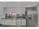 Modern kitchen with stainless steel appliances and white cabinetry at 3966 Oak Loop # 13, Mulberry, FL 33860