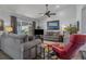 Living room with hardwood floors, seating area, and access to patio at 3966 Oak Loop # 13, Mulberry, FL 33860