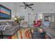 Bright living room with hardwood floors, comfy couches, and a large area rug at 3966 Oak Loop # 13, Mulberry, FL 33860