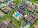 Community pool with lounge chairs and covered seating area at 3966 Oak Loop # 13, Mulberry, FL 33860
