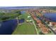 Aerial view of community with golf course, lake, and numerous houses at 4193 Limerick Dr, Lake Wales, FL 33859