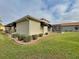 Landscaped backyard with lush lawn and manicured hedges at 4193 Limerick Dr, Lake Wales, FL 33859