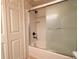 Bathroom with tub shower, updated vanity, and patterned wallpaper at 4193 Limerick Dr, Lake Wales, FL 33859
