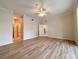 Primary bedroom with wood-look floors and multiple doorways at 4193 Limerick Dr, Lake Wales, FL 33859