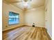 Spacious bedroom with large window and wood-look floors at 4193 Limerick Dr, Lake Wales, FL 33859