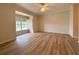 Bright bedroom with wood-look floors and ceiling fan at 4193 Limerick Dr, Lake Wales, FL 33859