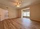 Spacious bedroom with wood-look floors and a bay window at 4193 Limerick Dr, Lake Wales, FL 33859